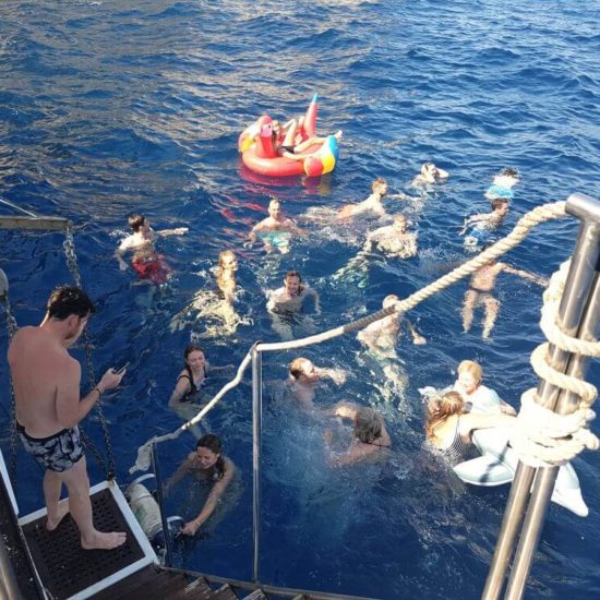 People having fun and bathing in luxury yacht ship