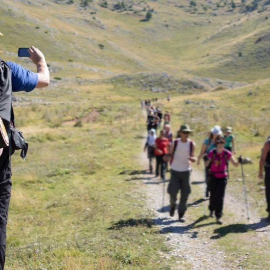 Young hiker with backpack and boots