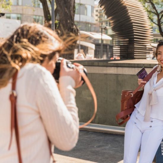 Vacation photographer taking picture of a client