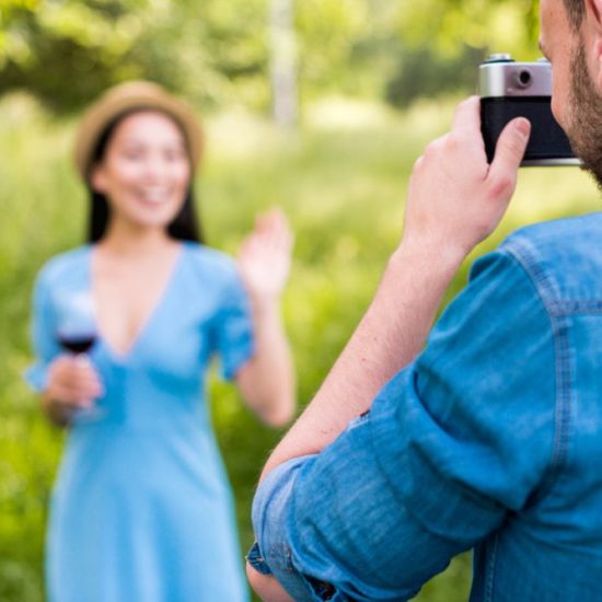 Vacation photographer taking picture of a client